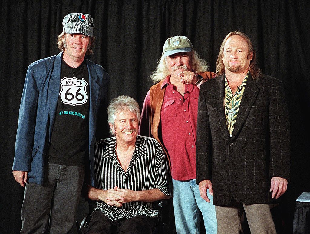 David Crosby (2nd from R) points to an audience me